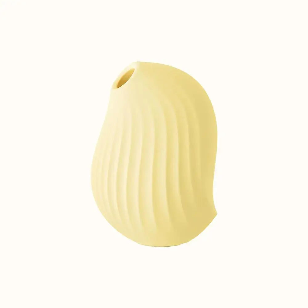 A compact, ergonomic lemon yellow clitoral suction device designed for pleasure, with a smooth surface and ipx7 waterproof, have fun in the tub or shower