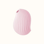 A compact, pink, ergonomic clit stimulator device designed for pleasure, with a smooth surface and body-safe silicone